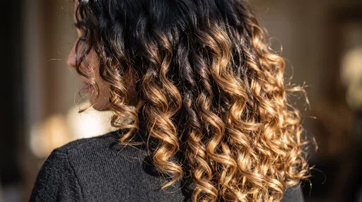 Close-Up of Curly Caramel Balayage Hair