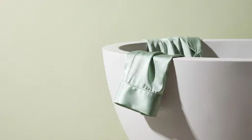 Mint Silk Pajama Sleeve on White Bathtub