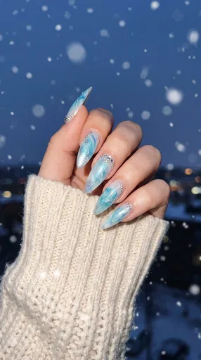 Icy Blue Marble Winter Stiletto Nails