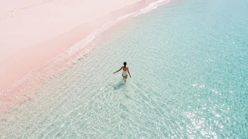 Aerial View of Woman in Turquoise Ocean