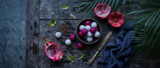 Scooped Dragon Fruit on Weathered Table