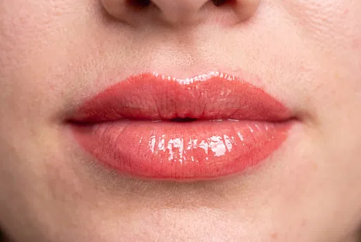 Macro Close-Up of Glossy Coral Lips