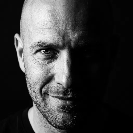 Monochrome Portrait of Smirking Bald Man