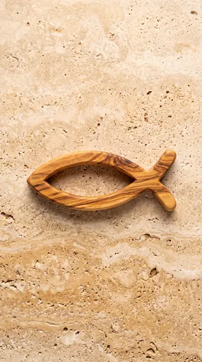 Wooden Christian Fish Symbol on Stone