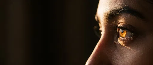Close-Up Profile of Sunlit Amber Eye