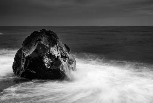 Monochrome Volcanic Boulder in Silky Ocean Surf