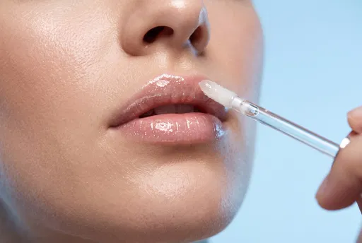 Close-Up of Lip Gloss Application
