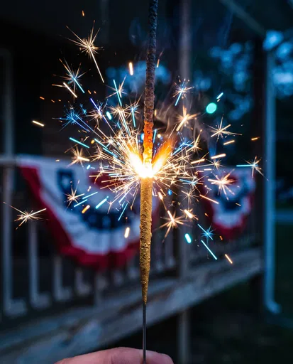 Glowing Sparkler on Fourth of July Porch