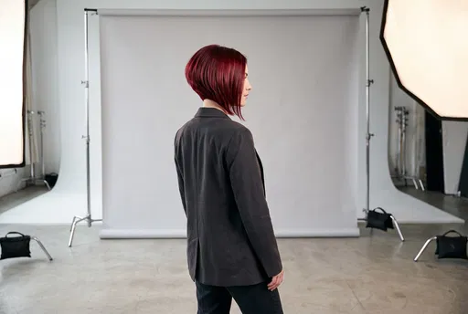 Woman With Red Inverted Bob in Studio