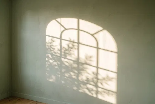 Arched Window Sunlight Shadow on Sage Wall