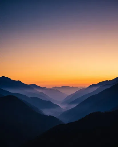 Layered Mountain Silhouettes at Dusk