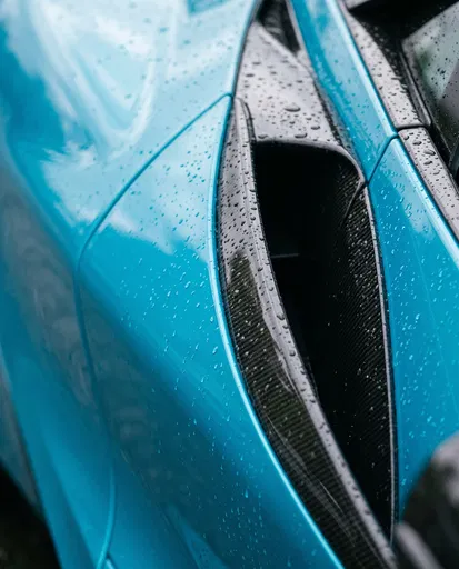 Raindrops on Blue Supercar Carbon Intake