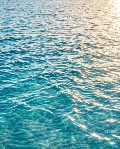 Sunlit Turquoise Ocean Water Surface Ripples
