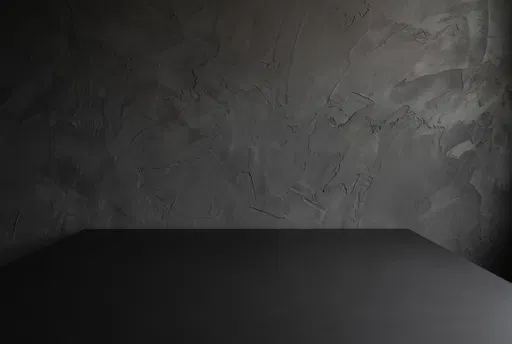 Dark Textured Plaster Wall and Tabletop