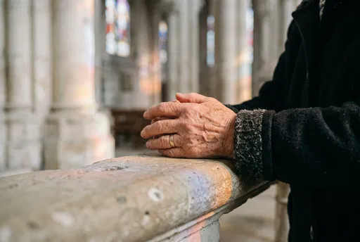 Elderly Hands Clasped on Limestone Rail