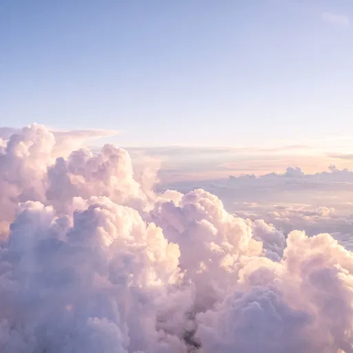 Pastel Cumulus Clouds in Pale Blue Sky
