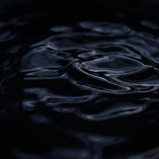 Dark Rippling Viscous Black Liquid Surface