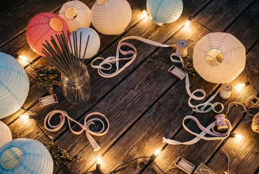 Paper Lanterns and Sparklers on Wooden Deck
