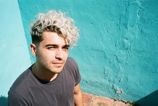 Young Man With Platinum Curly Fade