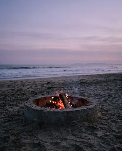 Beach Bonfire in Concrete Ring at Dusk