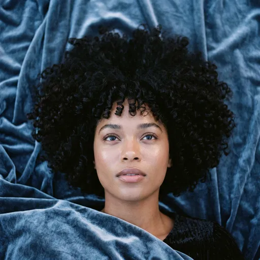 Woman With Curly Halo Bob On Velvet