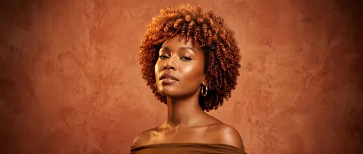 Woman With Copper Coily Hair Studio Portrait