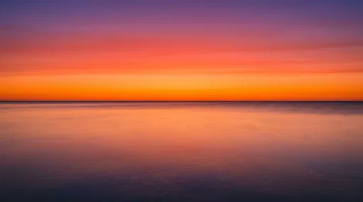 Minimalist Vibrant Sunset Over Smooth Ocean
