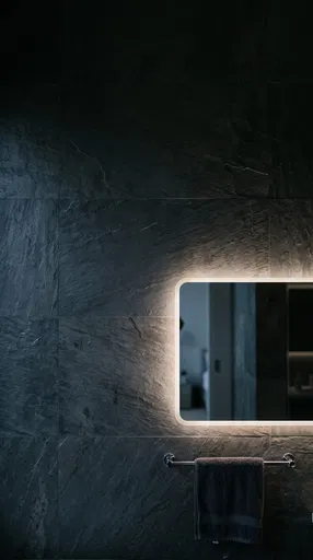 Dark Slate Bathroom Wall With Backlit Mirror