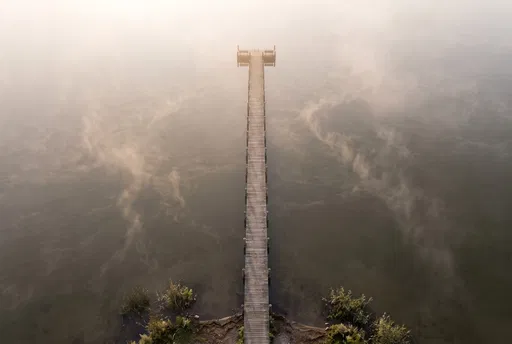 Aerial View of Misty Lake Pier