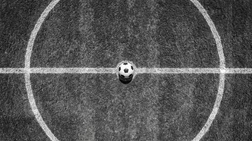 Monochrome Top-Down Soccer Ball on Pitch