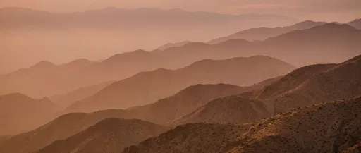 Layered Desert Mountain Ridges at Dusk