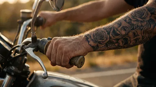 Tattooed Arm Gripping Motorcycle Handlebar
