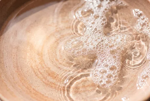 Foamy Water Ripples in Ceramic Basin