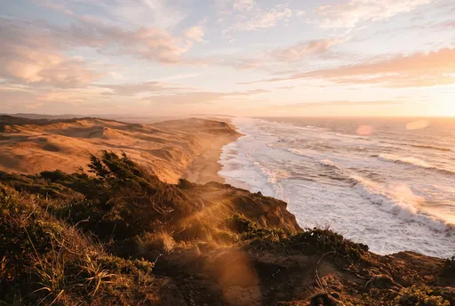 Golden Sunset Over Coastal Sand Dunes