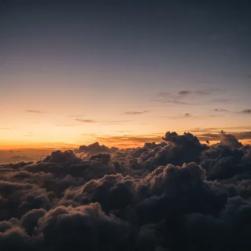 Dramatic Sunset View Above Dark Clouds