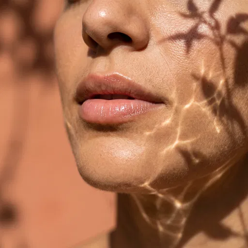 Close-Up of Glossy Lips in Sunlight