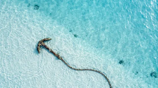 Sunken Rusty Anchor in Clear Turquoise Water