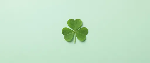 Single Green Shamrock on Mint Background