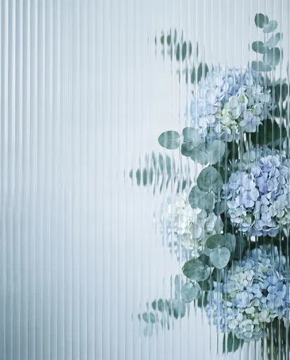 Blue Hydrangeas Behind Fluted Glass