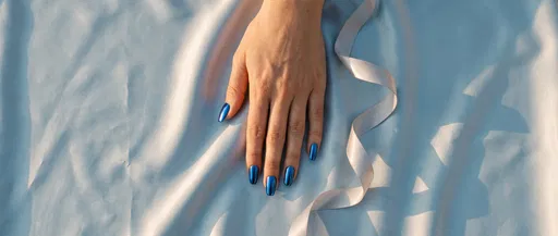 Hand With Blue Chrome Nails