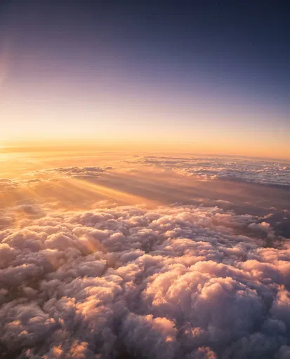 Golden Sunset Above Fluffy Clouds