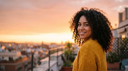 Smiling Woman on Rooftop at Sunset