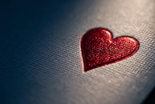 Macro Red Foil Heart on Textured Card