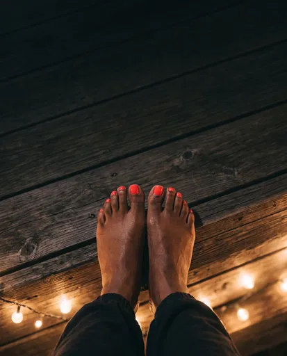 Overhead View of Pedicured Feet on Deck