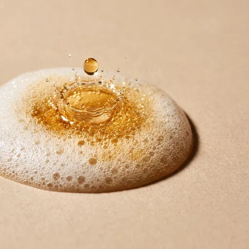Golden Liquid Drop Splashing in Foam