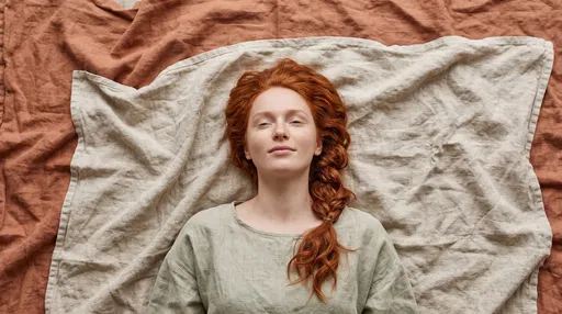 Redhead Woman Lying on Linen Blankets