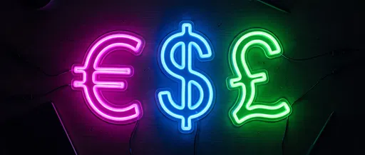 Glowing Neon Currency Symbols on Dark Desk