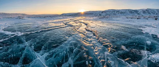 Frozen Arctic Stream at Sunset