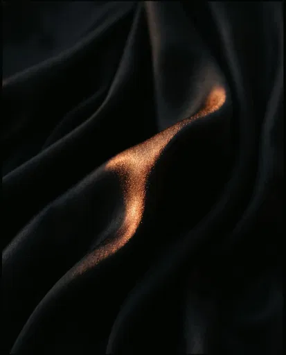 Black Satin Folds With Copper Highlight