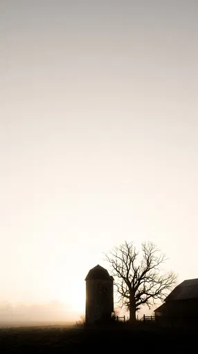 Silhouetted Farm Silo and Tree at Dawn